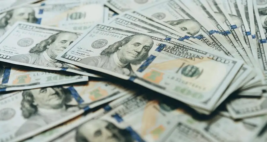Dollar set for fifth monthly drop on trade, fiscal uncertainty