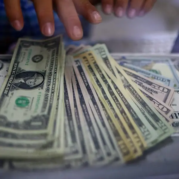 Dollar steady with trade tensions and economic data in focus