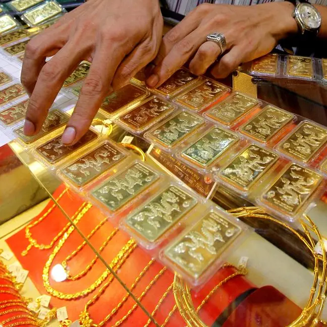 Safe-haven gold near a one-month low as global tensions ebb